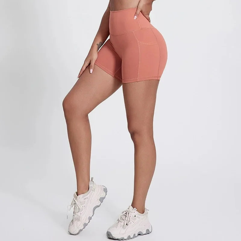 High-waisted nylon knit yoga shorts with welt pockets in multiple colors and sizes - product image