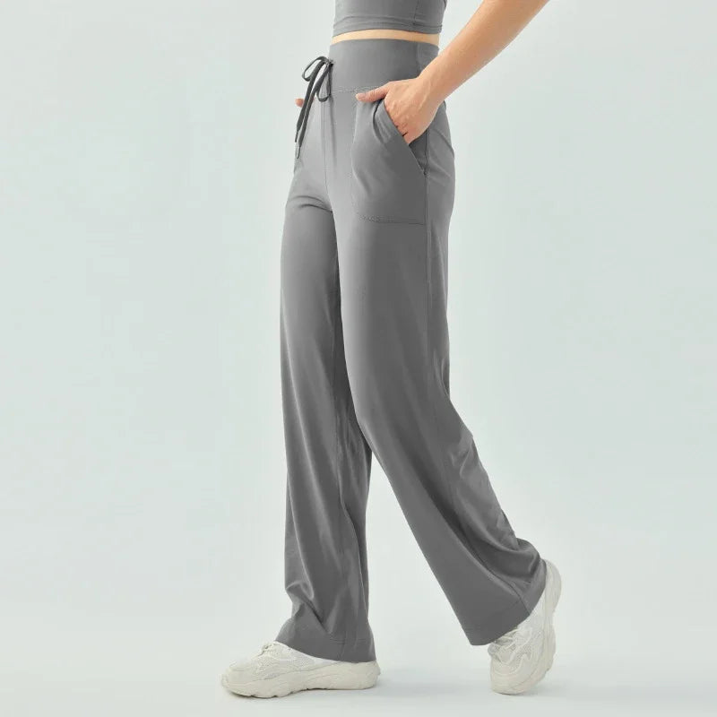 Nude color elastic waist nylon knit fitness trousers with welt pockets - product image