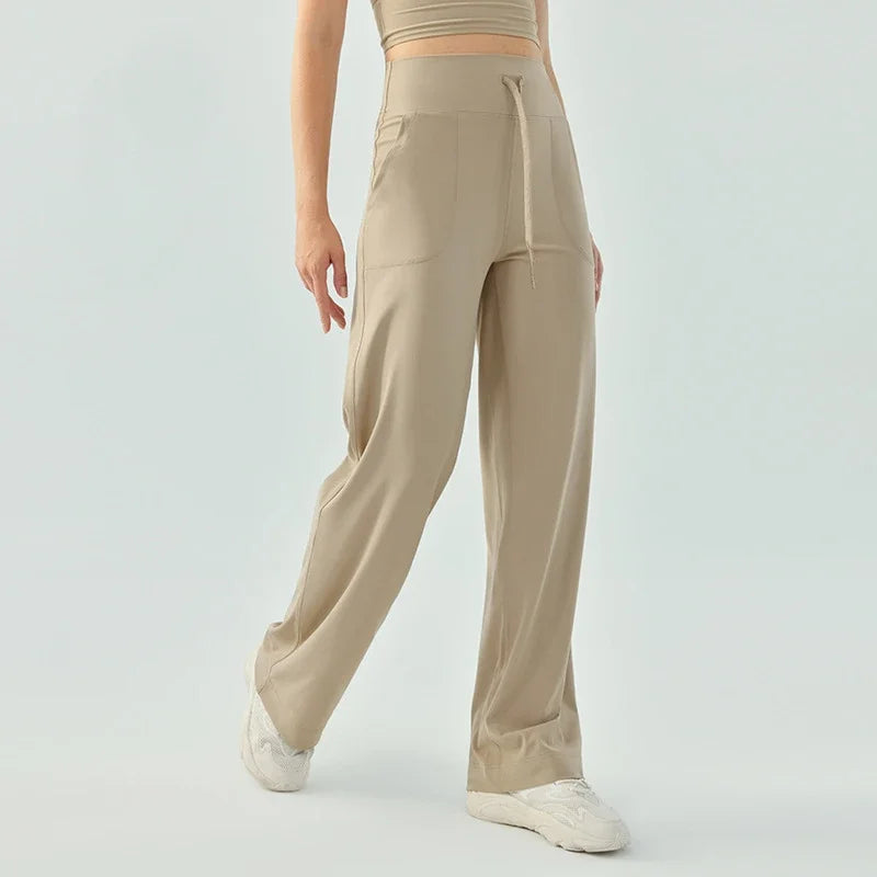 Nude color elastic waist nylon knit fitness trousers with welt pockets - product image
