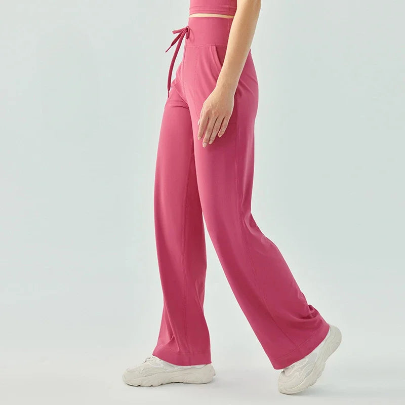 Nude color elastic waist nylon knit fitness trousers with welt pockets - product image