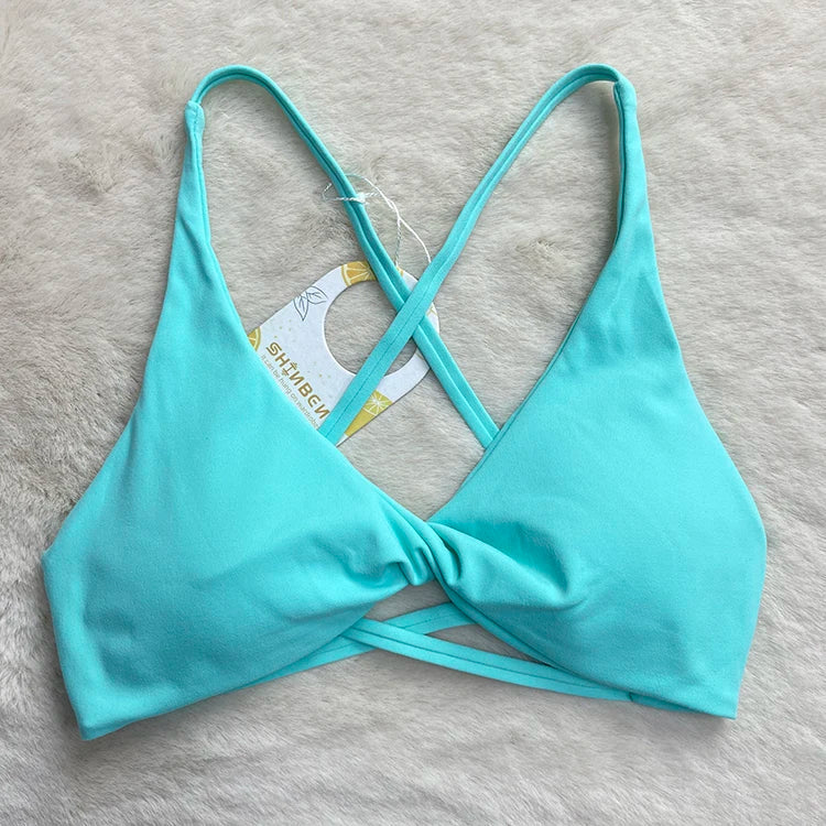 Sculpt peach cross strappy padded front twist yoga bra with quick dry nylon spandex - product image