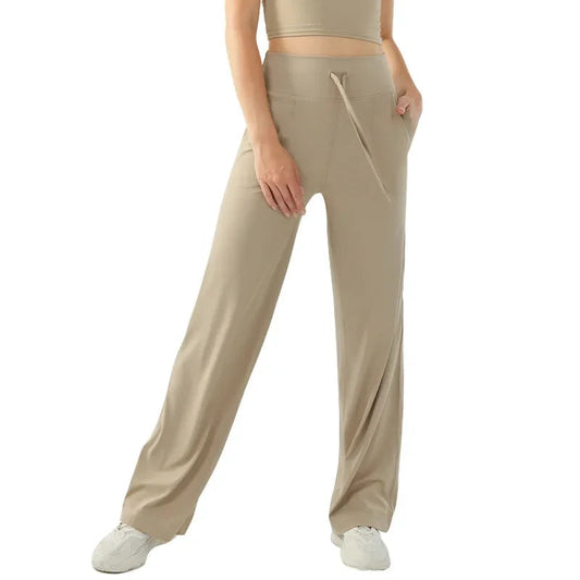 Nude color elastic waist nylon knit fitness trousers with welt pockets - product image