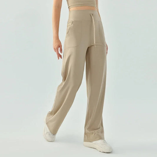 Nude color elastic waist nylon knit fitness trousers with welt pockets - product image
