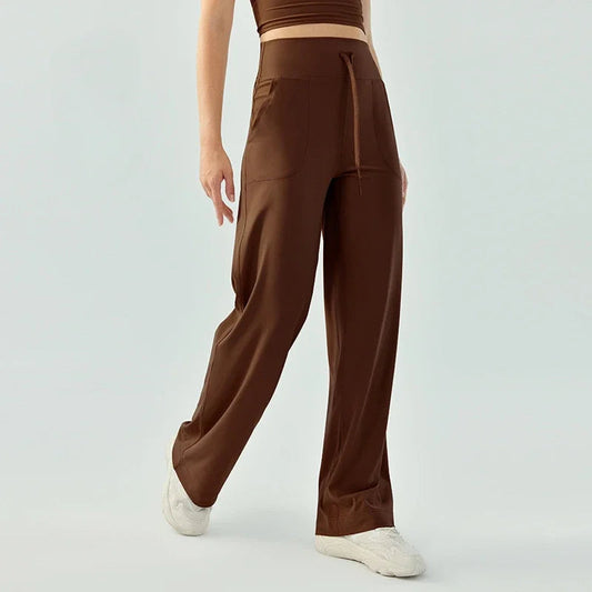 Nude color elastic waist nylon knit fitness trousers with welt pockets - product image