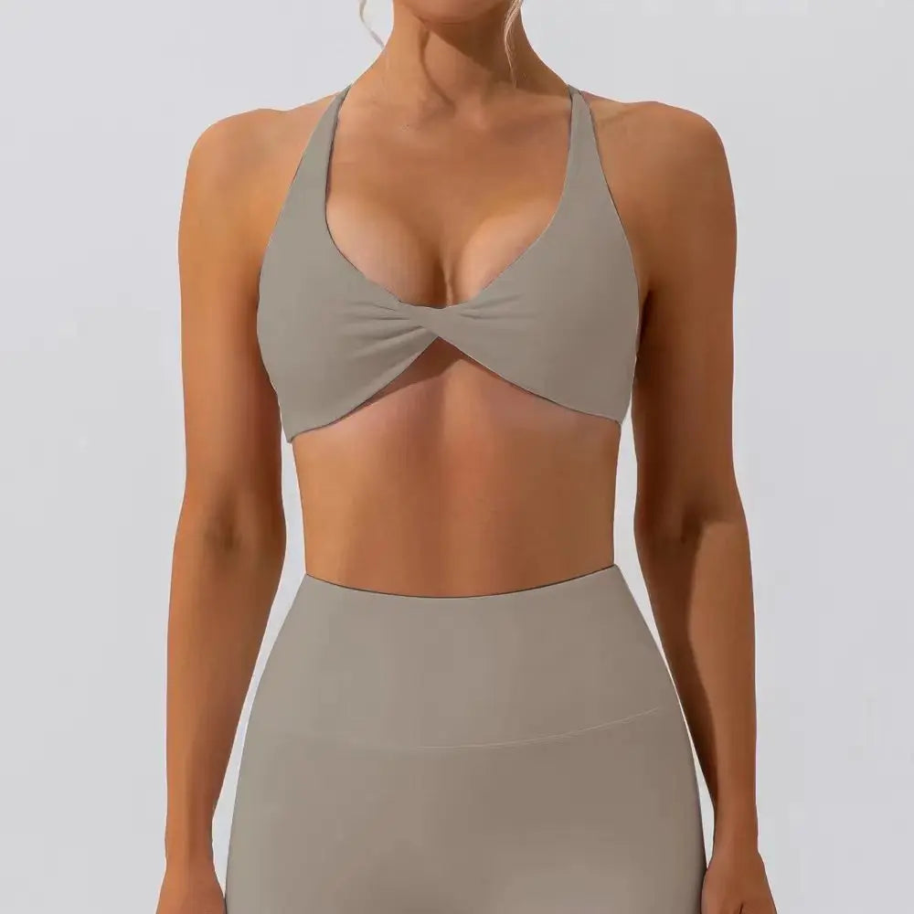 Sculpt peach cross strappy padded front twist yoga bra with quick dry nylon spandex - product image