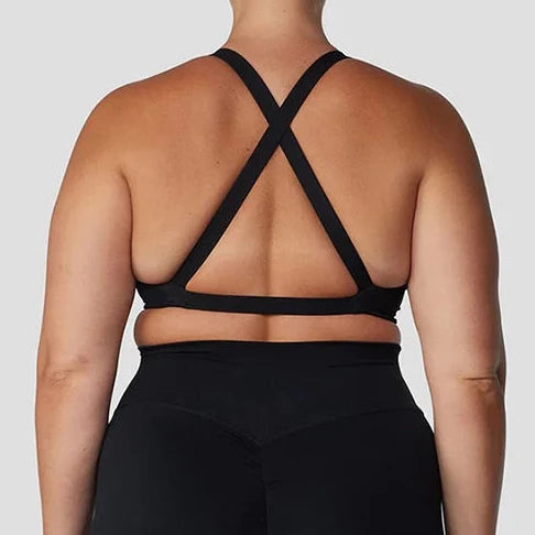 Strappy cross back padded nylon spandex knit yoga bra with twist front design - product image