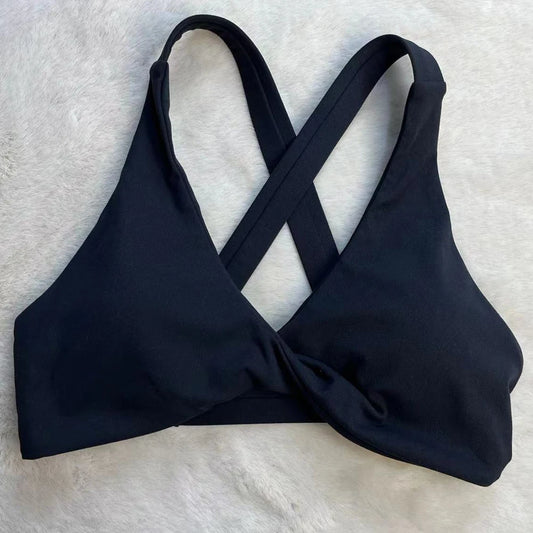 Strappy cross back padded nylon spandex knit yoga bra with twist front design - product image