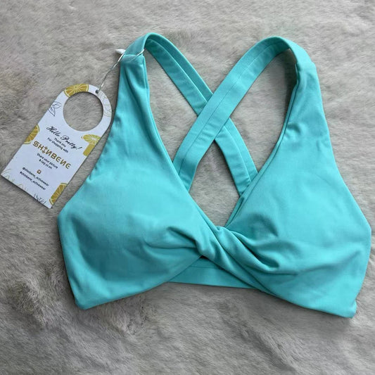 Strappy cross back padded nylon spandex knit yoga bra with twist front design - product image